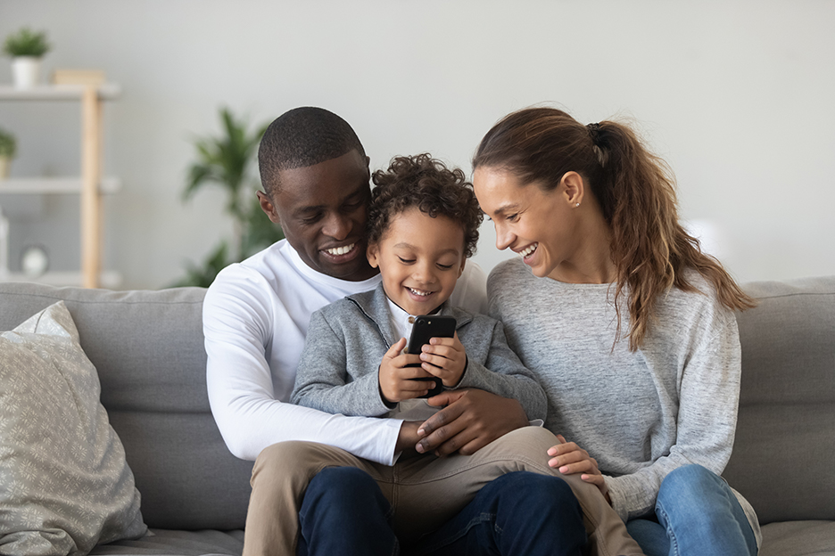 Multi-racial family smiling